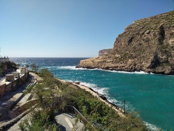 Scenic view of sea against clear blue sky