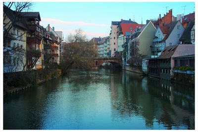 View of canal with buildings in background