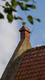 Low angle view of roof against sky
