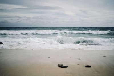 Scenic view of beach against sky