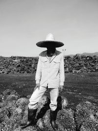 Rear view of woman standing on landscape