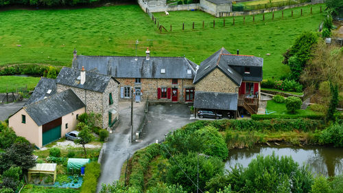 French brittany typical countryside houses. stone builts and slate roofs, in a green environment.