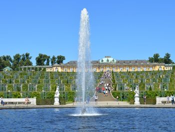 Fountain in park against clear sky