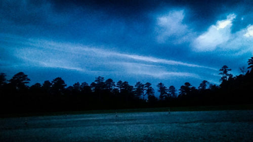 Scenic view of landscape against cloudy sky