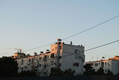 Low angle view of buildings against clear sky