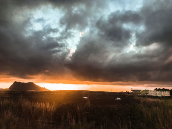 Scenic view of dramatic sky during sunset