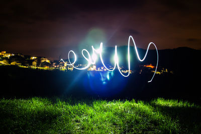 Light painting on field at night