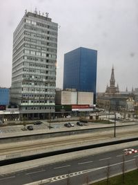Buildings in city against sky
