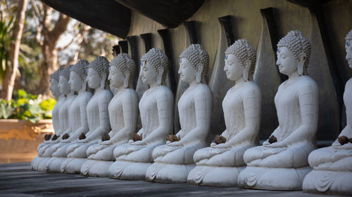 Statues in temple outside building