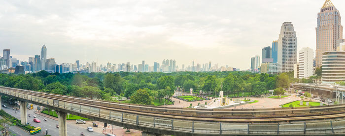 Panoramic view of modern buildings in city against sky