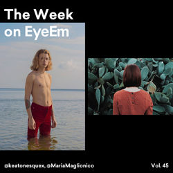 Rear view of two people looking at sea