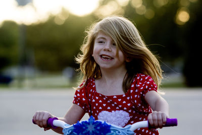 Portrait of smiling girl playing outdoors