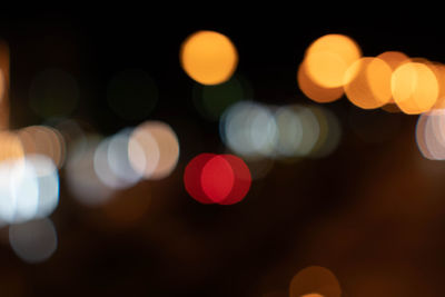 Defocused image of illuminated lights at night