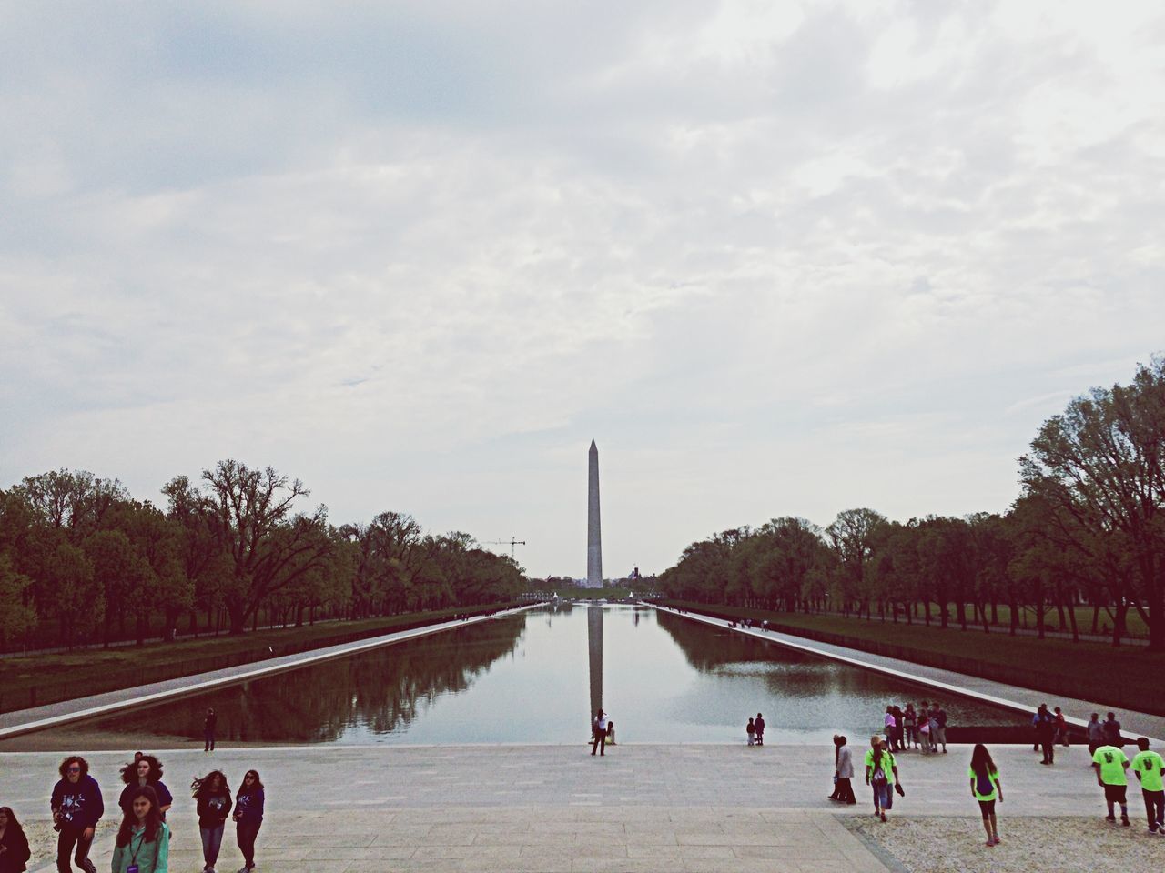 large group of people, lifestyles, architecture, person, men, tree, built structure, leisure activity, sky, water, mixed age range, tourist, bridge - man made structure, tourism, connection, river, travel destinations, cloud - sky, famous place