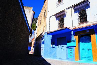 View of buildings against blue sky