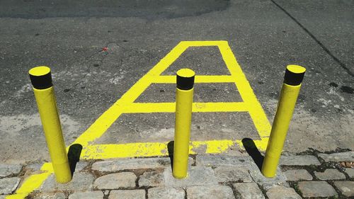 High angle view of road sign on street