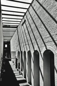 Low angle view of empty corridor in building