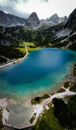 Scenic view of lake against cloudy sky