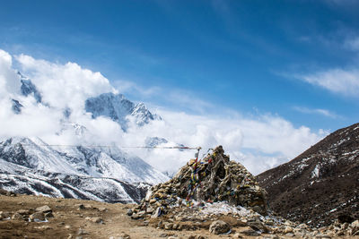 Scenic view of mountains against blue sky