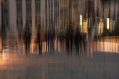 Rear view of man walking on footpath