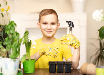 Portrait of girl playing with toy on table