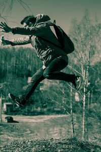 Man jumping on plant