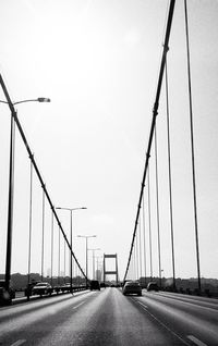 Surface level of suspension bridge against clear sky