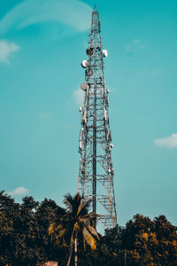 Low angle view of communications tower against sky