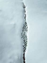 Close-up of frozen water against sky