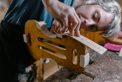 Midsection of a girl holding guitar