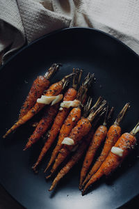 High angle view of baby carrots on the baking tray 