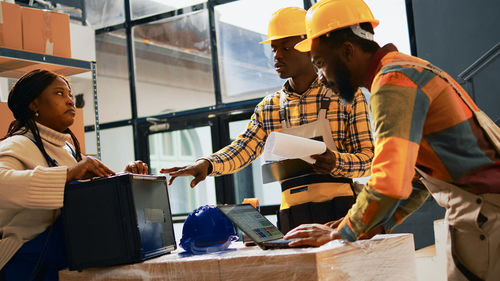 Side view of man working in office