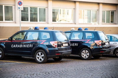 Cars on street against buildings