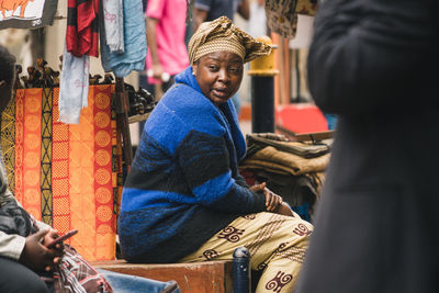 People sitting in market