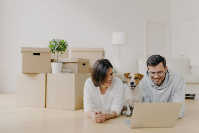 Close-up of couple using laptop