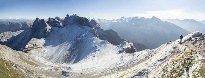 Panoramic view of snowcapped mountains against sky