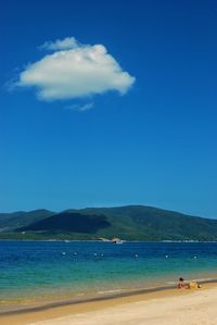 Scenic view of sea against blue sky