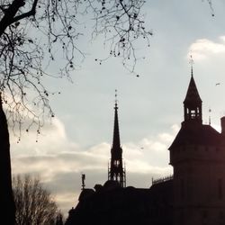 Low angle view of church against cloudy sky