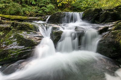 Long exposure of a waterfall on the hoar oak water river flowing through the woods at watersmeet