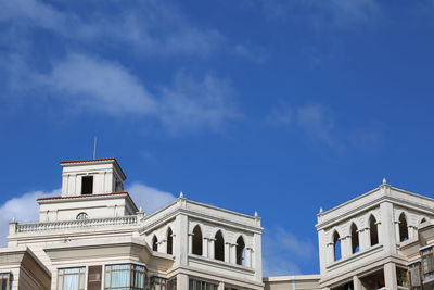 Low angle view of building against blue sky