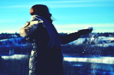 Woman standing against sky