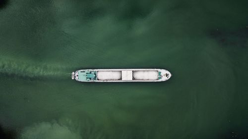 High angle view of boat floating on lake