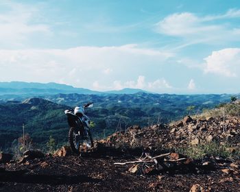 Panoramic view of people on landscape against sky