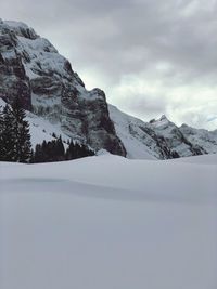 Scenic view of snowcapped mountains against sky