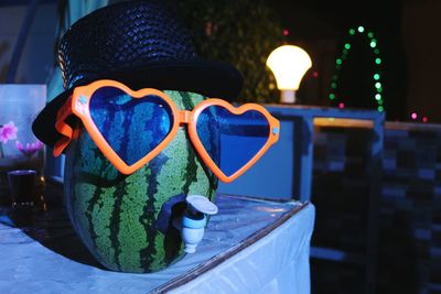 Close-up of illuminated lighting equipment at night