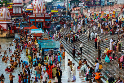 High angle view of people walking on street in city