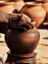 Close-up of hand working of earthen pot