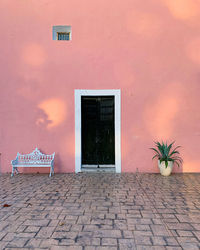 Exterior of house against orange wall