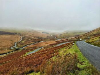 Road passing through field