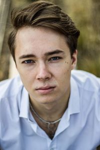 High angle portrait of young man standing outdoors